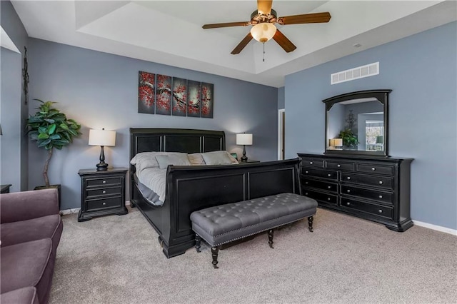 8912 NE 97th St, Kansas City, MO 64157 - bedroom with carpet floors, a tray ceiling, visible vents, and baseboards