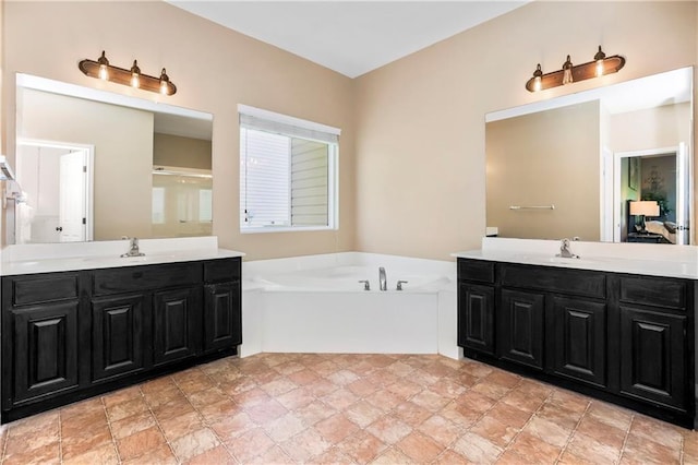 8912 NE 97th St, Kansas City, MO 64157 - full bathroom featuring two vanities, a garden tub, and a sink