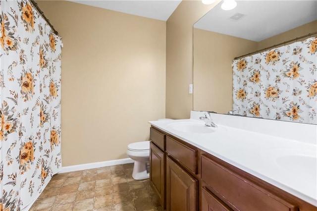 8912 NE 97th St, Kansas City, MO 64157 - full bathroom with a sink, double vanity, toilet, visible vents, and baseboards