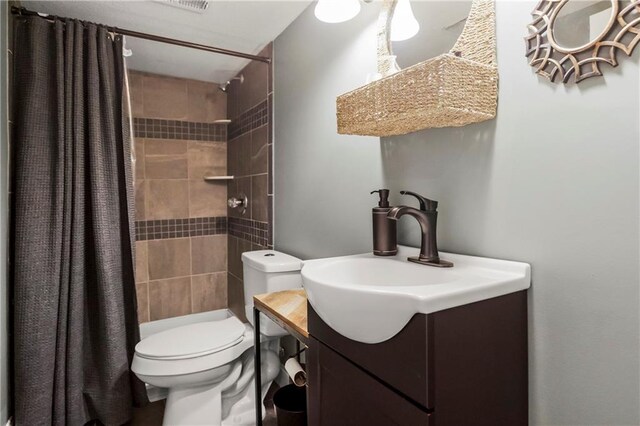 8912 NE 97th St, Kansas City, MO 64157 - bathroom with a tile shower, toilet, and vanity