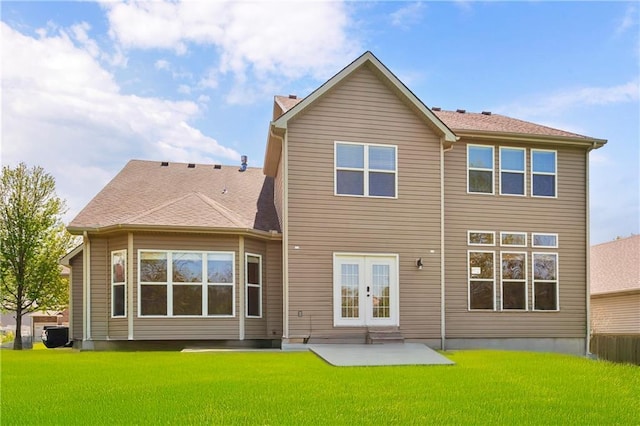 8912 NE 97th St, Kansas City, MO 64157 - rear view of property with a lawn and a patio