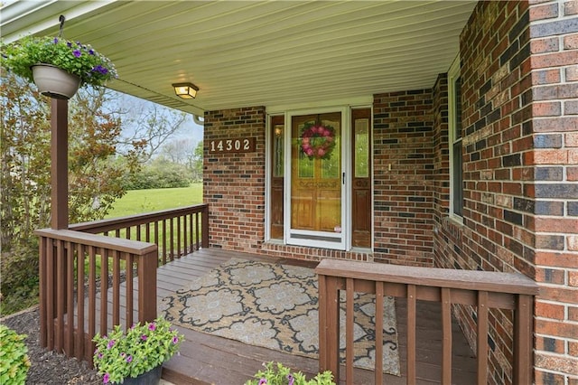 wooden terrace featuring a porch