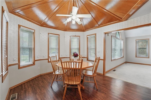 dining room with wallpapered walls, visible vents, and wood finished floors