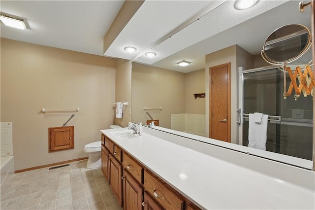 full bath featuring vanity, toilet, baseboards, a tub, and a shower stall
