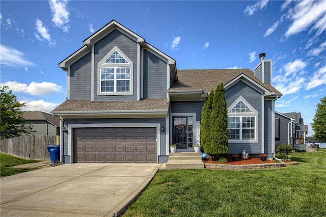 traditional-style home with a garage, a chimney, and driveway
