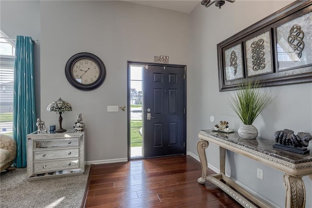 entryway featuring healthy amount of natural light, wood finished floors, and baseboards