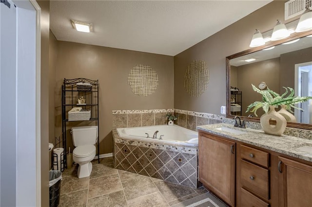 full bathroom with a bath, toilet, vanity, and baseboards