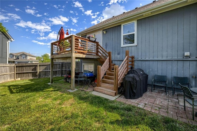 rear view of house with a deck, a patio area, and stairs