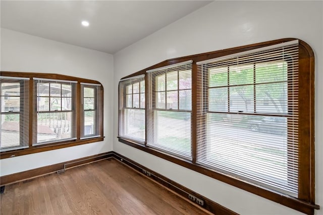 5547 Rockhill Rd, Kansas City, MO 64110 - unfurnished room with recessed lighting, baseboards, and dark wood-style floors