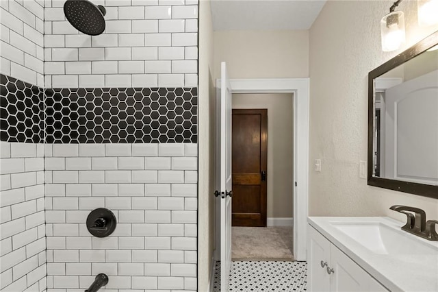 5547 Rockhill Rd, Kansas City, MO 64110 - full bath featuring a tile shower, vanity, and tile patterned floors