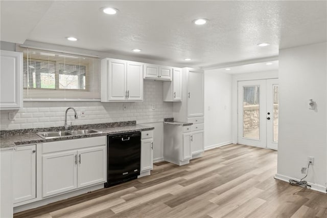 5547 Rockhill Rd, Kansas City, MO 64110 - kitchen featuring backsplash, black dishwasher, white cabinets, and a sink