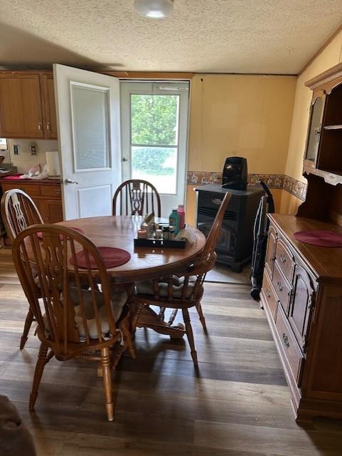 4323 NW County Road 17402nd St, Adrian, MO 64720 - dining area with a textured ceiling and light wood finished floors