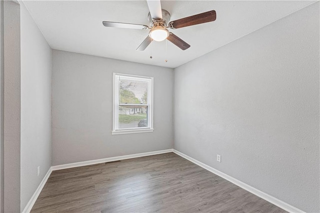 709 W 28th St N, Independence, MO 64050 - unfurnished room featuring baseboards, a ceiling fan, and wood finished floors