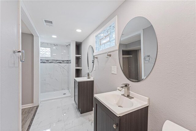 709 W 28th St N, Independence, MO 64050 - bathroom with a sink, plenty of natural light, visible vents, marble finish floor, and a shower stall