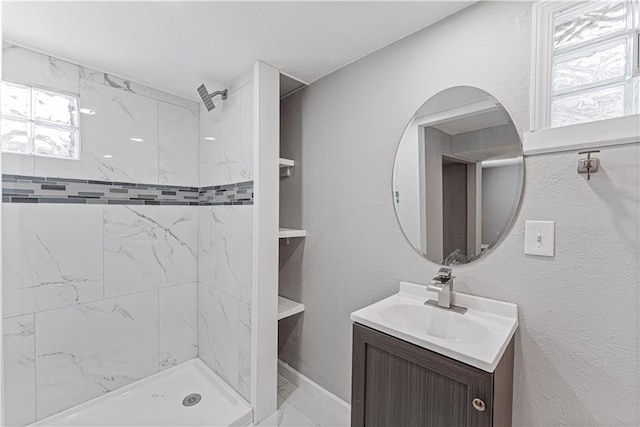 709 W 28th St N, Independence, MO 64050 - full bath featuring marble finish floor, baseboards, vanity, and a stall shower