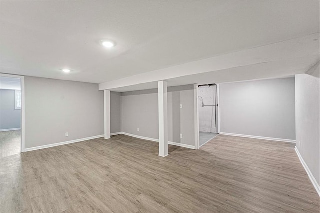 709 W 28th St N, Independence, MO 64050 - finished below grade area featuring recessed lighting, wood finished floors, and baseboards