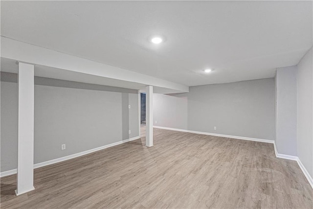 709 W 28th St N, Independence, MO 64050 - finished below grade area featuring baseboards, wood finished floors, and recessed lighting