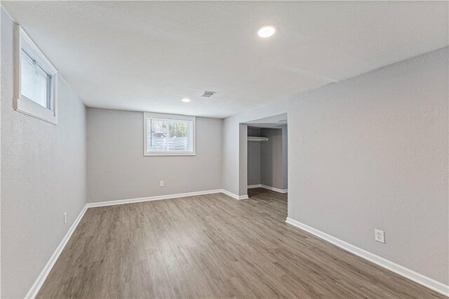 709 W 28th St N, Independence, MO 64050 - basement featuring recessed lighting, wood finished floors, visible vents, and baseboards