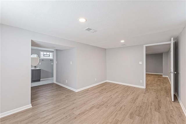 709 W 28th St N, Independence, MO 64050 - basement with baseboards, visible vents, and light wood-style floors