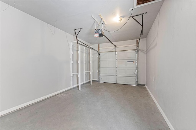 709 W 28th St N, Independence, MO 64050 - garage with a garage door opener and baseboards