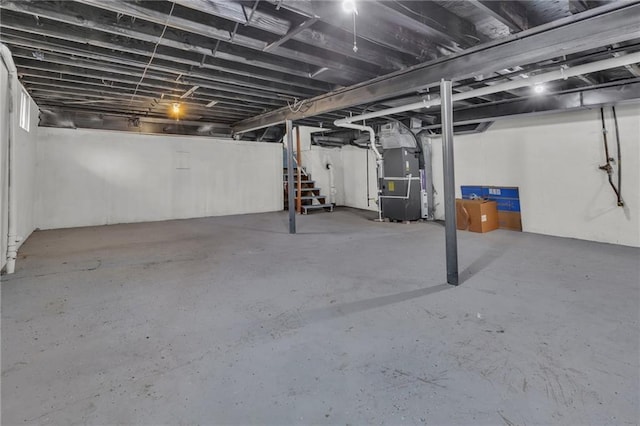 unfinished below grade area with stairway and heating unit