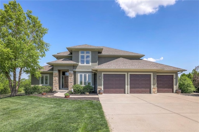18670 W 248th St, Paola, KS 66071 - prairie-style house featuring an attached garage, stucco siding, concrete driveway, stone siding, and a front lawn