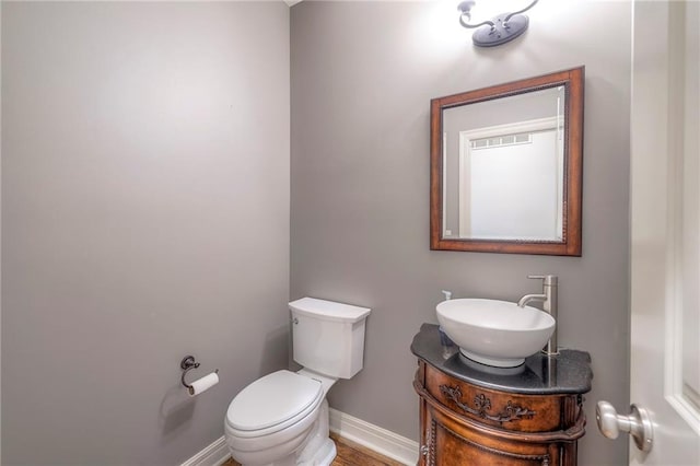 18670 W 248th St, Paola, KS 66071 - half bathroom with baseboards, toilet, and vanity