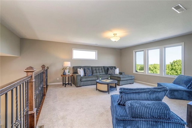 18670 W 248th St, Paola, KS 66071 - living area featuring healthy amount of natural light, carpet flooring, and baseboards