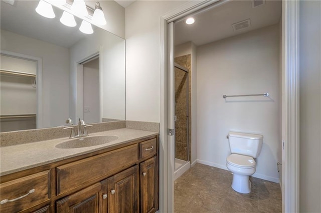 18670 W 248th St, Paola, KS 66071 - bathroom with toilet, a shower stall, vanity, baseboards, and a walk in closet