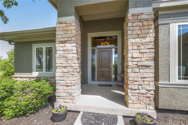 18670 W 248th St, Paola, KS 66071 - doorway to property with stone siding and stucco siding