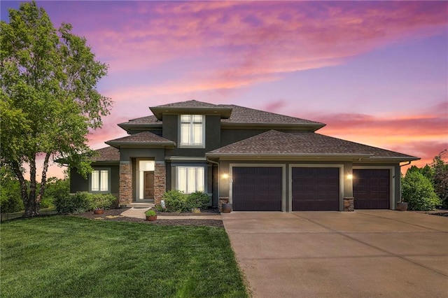 18670 W 248th St, Paola, KS 66071 - prairie-style house with driveway, a garage, a front lawn, stone siding, and stucco siding
