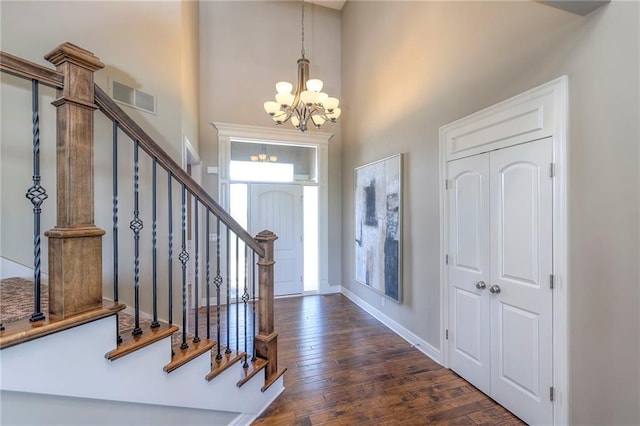 18670 W 248th St, Paola, KS 66071 - entryway with a chandelier, hardwood / wood-style flooring, a high ceiling, stairs, and baseboards