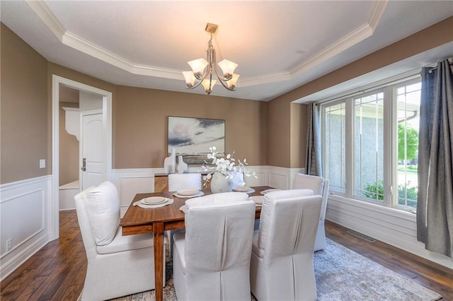 18670 W 248th St, Paola, KS 66071 - dining space with a chandelier, healthy amount of natural light, ornamental molding, a tray ceiling, and hardwood / wood-style flooring