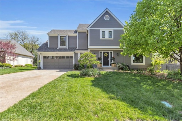 view of front of property with a front lawn, driveway, a shingled roof, an attached garage, and fence