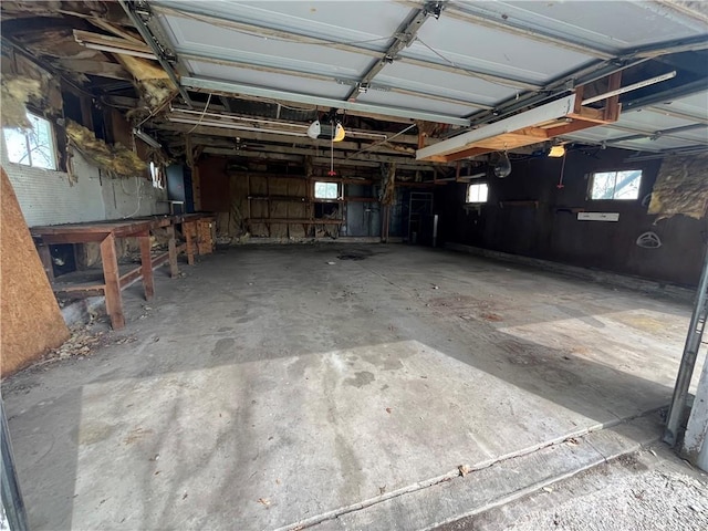 garage with a garage door opener and electric panel