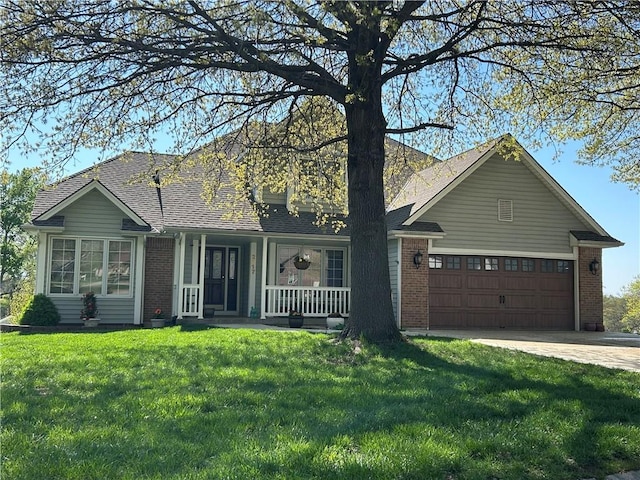 2317 Rhonda Rd, Excelsior Springs, MO 64024 - view of front of house with brick siding, a porch, a front lawn, driveway, and an attached garage