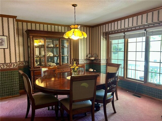 2317 Rhonda Rd, Excelsior Springs, MO 64024 - dining room with wallpapered walls, carpet floors, and wainscoting