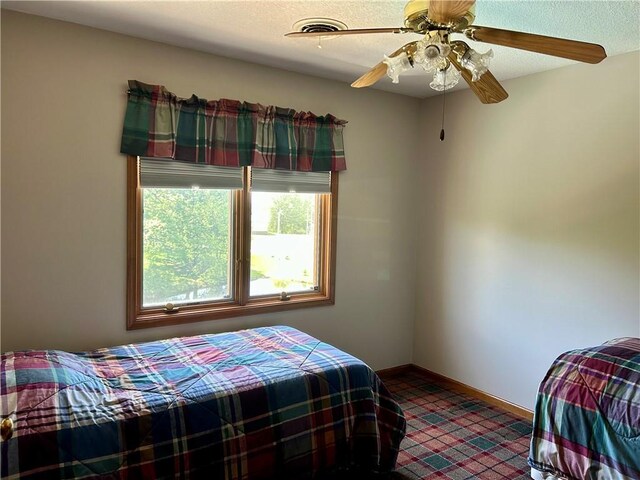2317 Rhonda Rd, Excelsior Springs, MO 64024 - bedroom featuring baseboards and ceiling fan