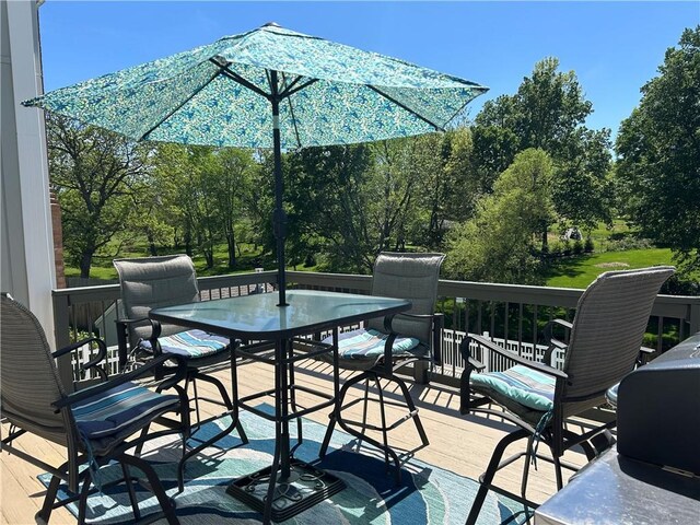 2317 Rhonda Rd, Excelsior Springs, MO 64024 - wooden deck featuring outdoor dining space