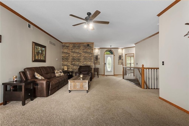 living room with crown molding, light carpet, a ceiling fan, baseboards, and visible vents