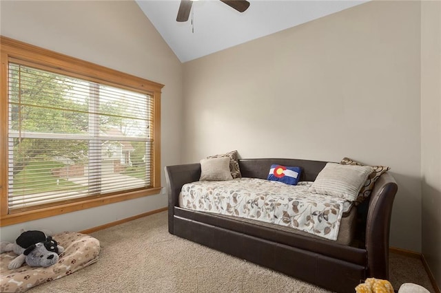 bedroom with a ceiling fan, baseboards, carpet, and lofted ceiling