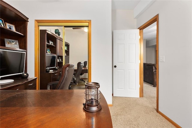 office area with carpet flooring and baseboards