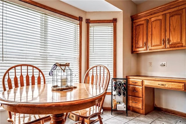 30994 W 98th St, De Soto, KS 66018 - dining room with light tile patterned floors, baseboards, and a desk