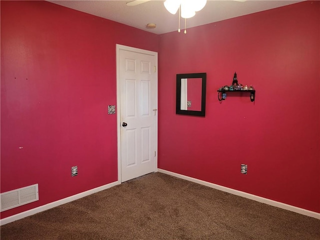 30994 W 98th St, De Soto, KS 66018 - empty room featuring dark carpet, a ceiling fan, and baseboards
