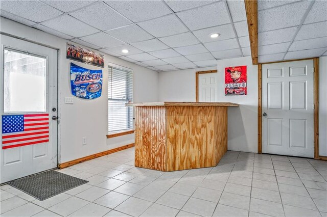 30994 W 98th St, De Soto, KS 66018 - entryway featuring a dry bar, a drop ceiling, recessed lighting, baseboards, and light tile patterned flooring
