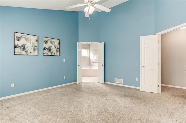 14095 S Mullen St, Olathe, KS 66062 - unfurnished bedroom featuring visible vents, baseboards, high vaulted ceiling, and carpet floors