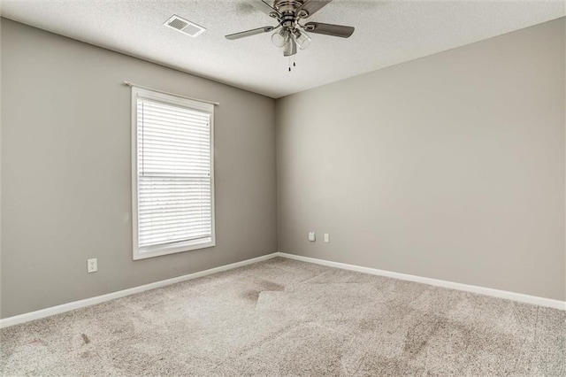 14095 S Mullen St, Olathe, KS 66062 - spare room with visible vents, a healthy amount of sunlight, a ceiling fan, and carpet flooring