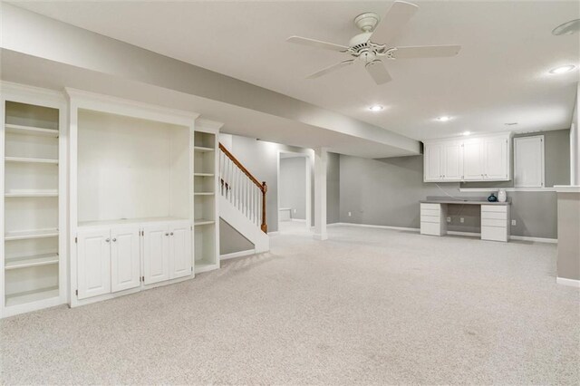 14095 S Mullen St, Olathe, KS 66062 - finished below grade area featuring a ceiling fan, stairway, light carpet, and baseboards