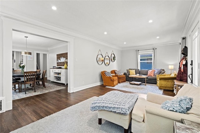 5518 Virginia Ave, Kansas City, MO 64110 - living room with dark wood finished floors, crown molding, recessed lighting, and baseboards