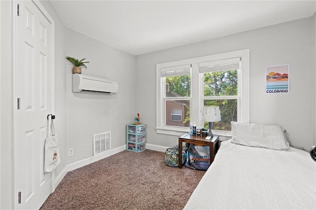 5518 Virginia Ave, Kansas City, MO 64110 - carpeted bedroom featuring a wall mounted air conditioner and baseboards